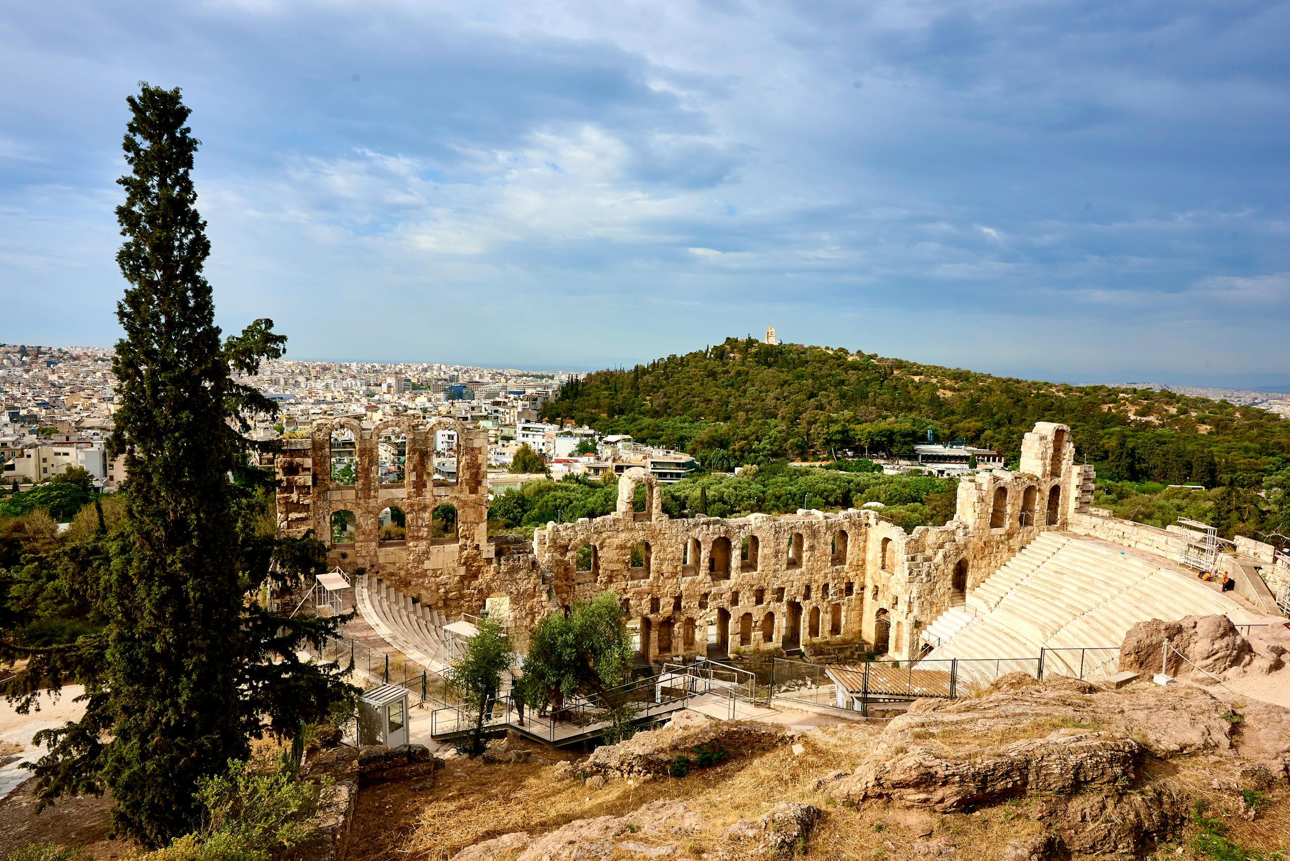 The Odeon of Herodes Atticus in Athens under a clear sky.