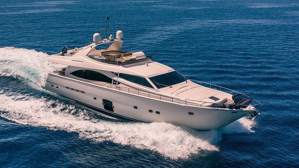 ANNOUKA luxury motor yacht cruising at full speed on open blue waters, viewed from the side.
